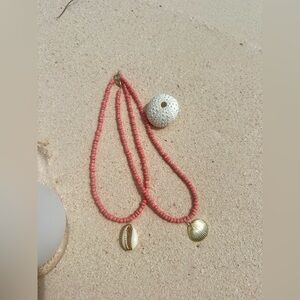 pink seed-bead necklace with golden clamshell pendant!